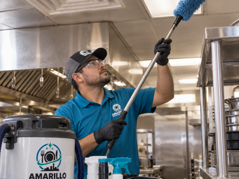 Overhead kitchen light fixture, HVAC diffuser, and stainless shelving being cleaned with dust-capture tools